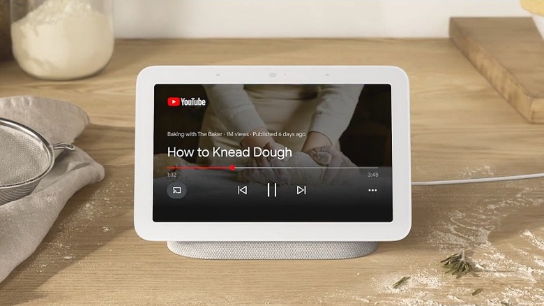 Google Nest Hub playing a video on how to knead a dough.
