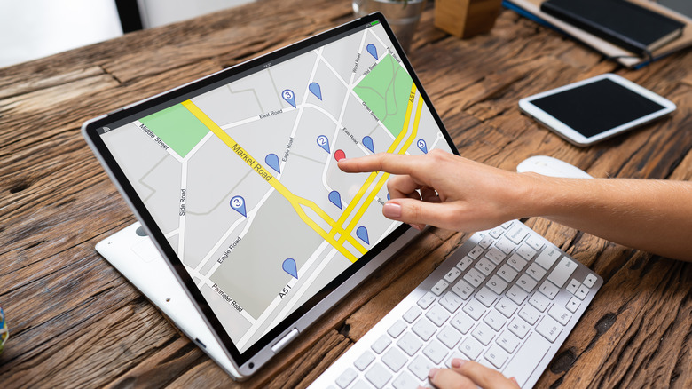 Person using laptop with a touchscreen display