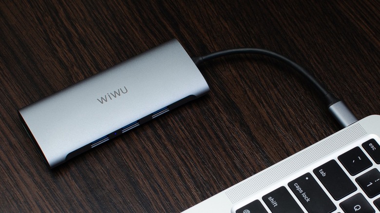 a USB-C hub attached to a MacBook