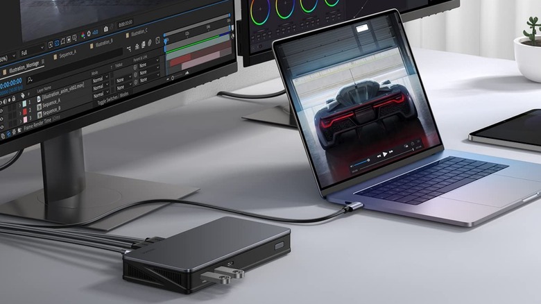 the Ugreen Revodok Pro 9-in-1 USB-C DisplayLink Docking Station attached to a MacBook