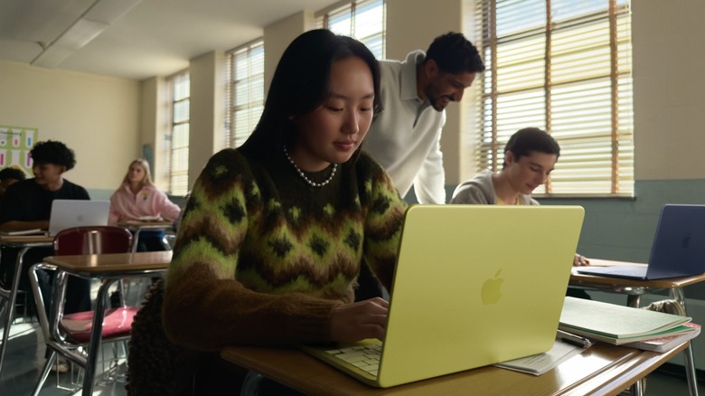 Students in a classroom using the MacBook Neo