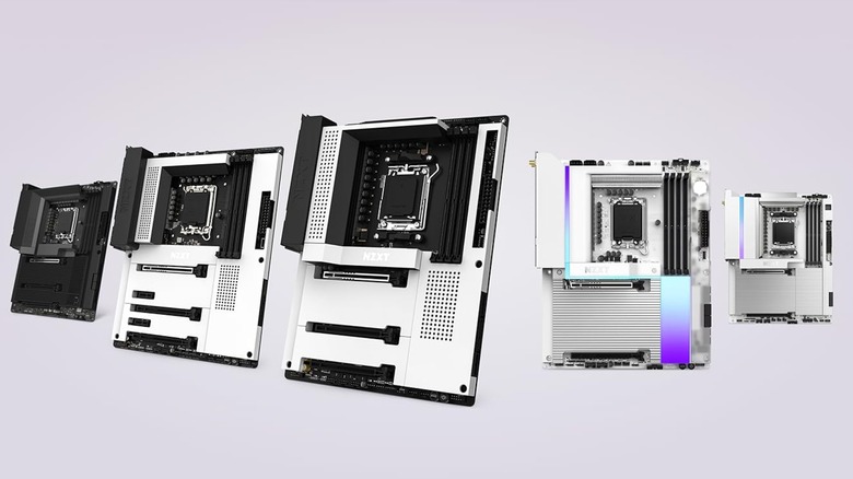 Five different NZXT motherboards displayed on a pinkish to white gradient background.
