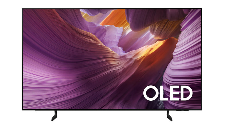 A Samsung QN65S84FA OLED televisions displays a colorful cavern