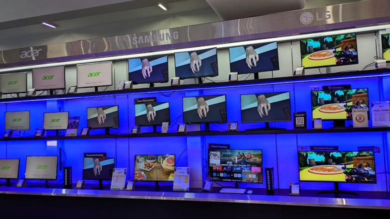 Computer monitors displayed in an electronics store