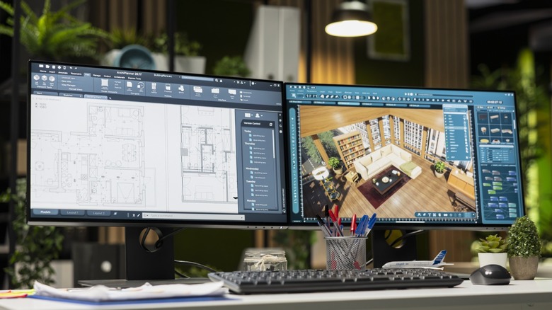Two widescreen monitors showing the bezels separating the two displays