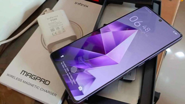 The Infinix Note 50 Pro on top of its box