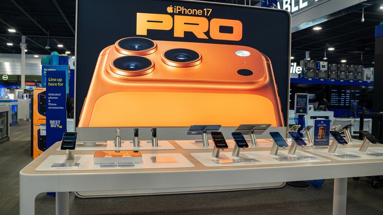 iPhone 17 on display in a store.