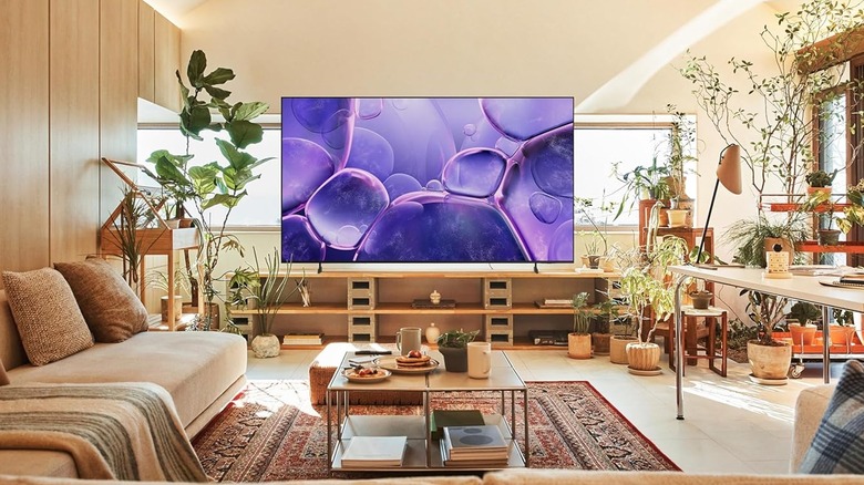 LED TV showing a purple display placed in an old-fashioned, well-lit living room.