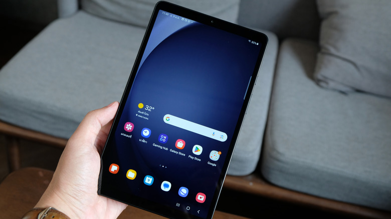 A person holding a Samsung A9 Tab in their hand