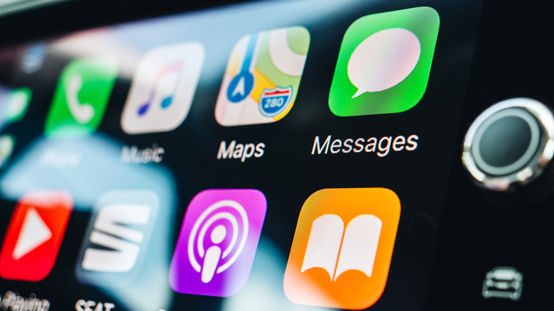 App icons on the the Apple CarPlay main screen on car dashboard during driving