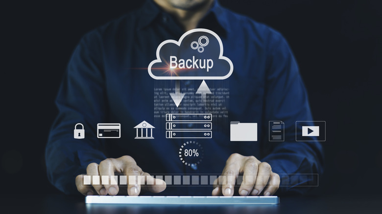 A depiction of a data backup being carried out as a person types on a keyboard