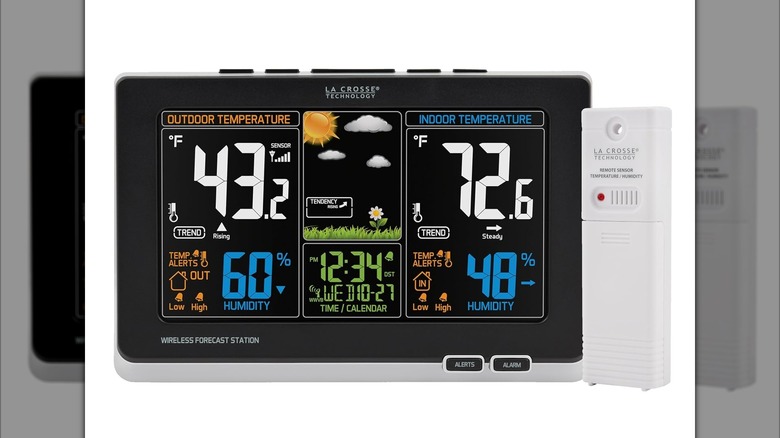 A weather sensor and a digital clock with a three-panel display showing a complete weather report alongside the time.