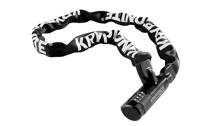 A Kryptonite chain combination bike lock, covered with a black nylon sleeve with the Kryptonite logo printed on it in white, against a white background.