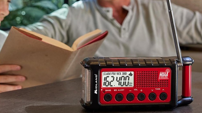 A red and black Midland emergency radio with six buttons