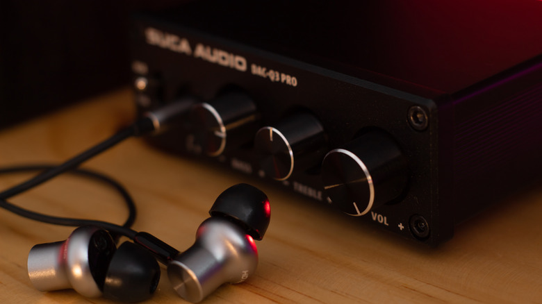 a pair of earphones pluged into a DAC