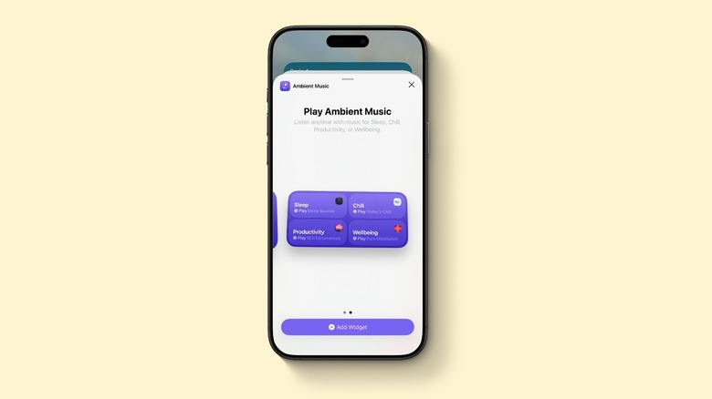 An iPhone displaying new Ambient Music widgets in iOS 26.4