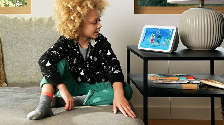 Child working with Alexa to create a story