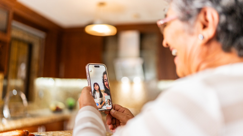 Woman talking to family on video call at home