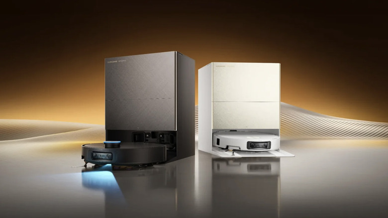 A pair of Dreame X60 Max Ultra Complete robot vacuums on a stylized background.