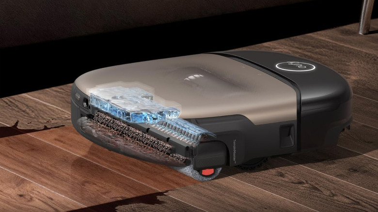 A Eufy Omni S2 Robot Vacuum cleaning a wood floor.