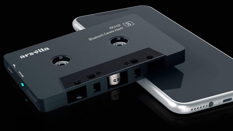 An Asvita tape adapter sitting on top of a smartphone.