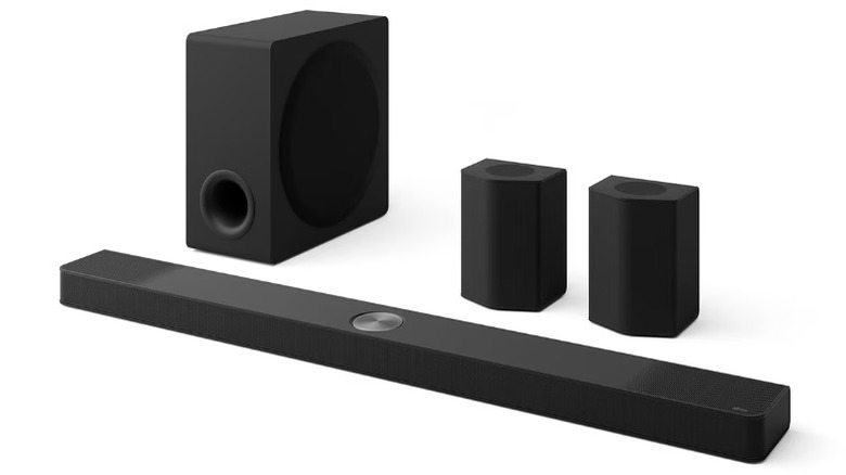 The LG S95TR soundbar system, including the soundbar itself, the rear satellites, and the wireless subwoofer.