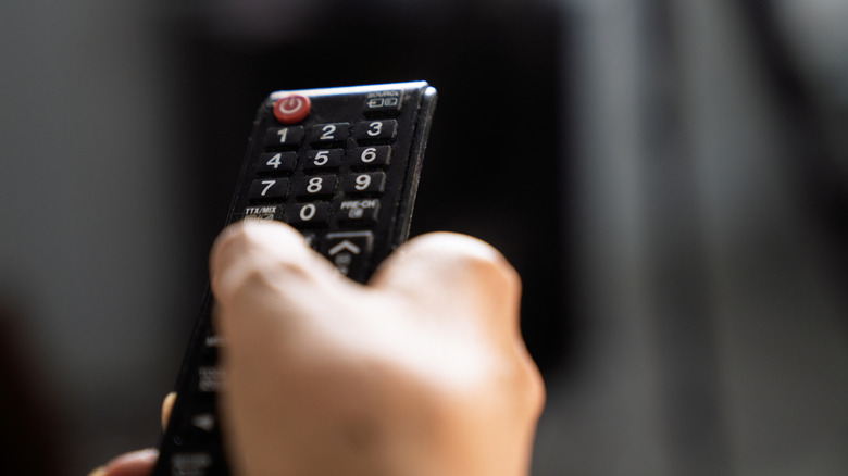 A remote in front of the TV