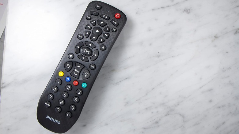 The Philips SRP9232D/27 universal remote on a marble table