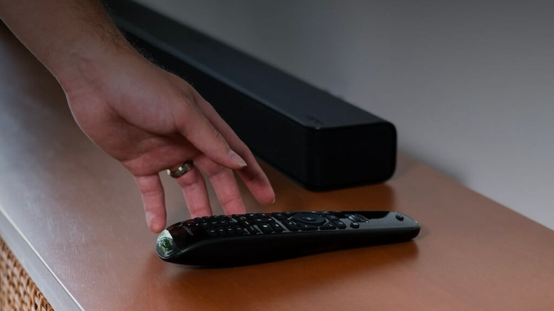 The Sofabaton U2 universal remote next to a soundbar