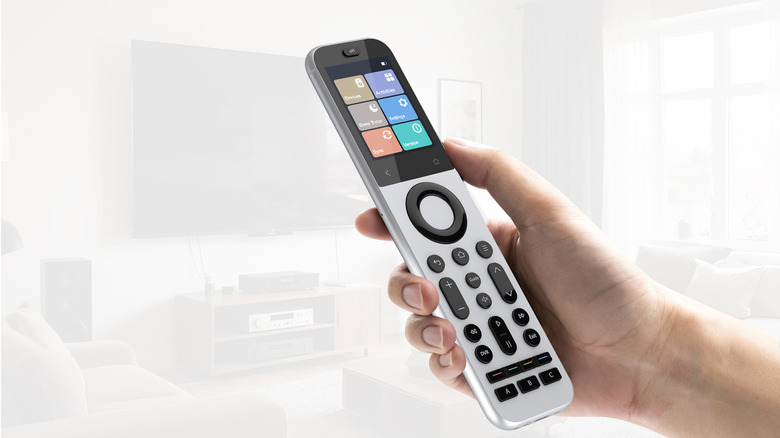 Holding the Sofabaton X2 universal remote