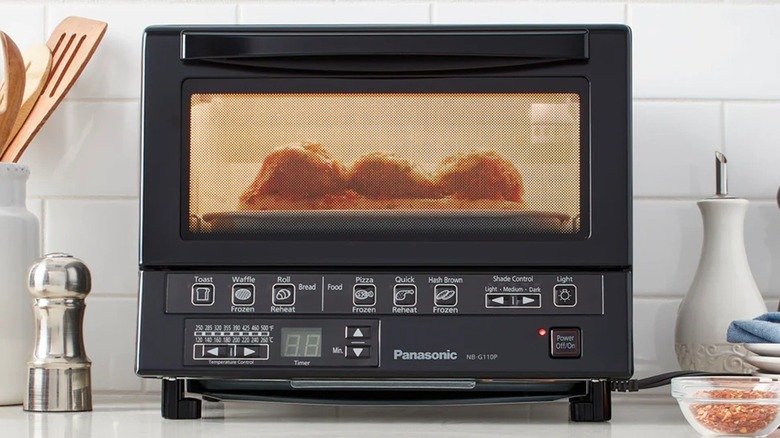 The Panasonic FlashXpress NB-G110P toaster oven heating chicken.