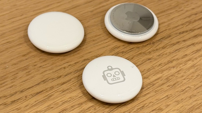 Three AirTags on a table