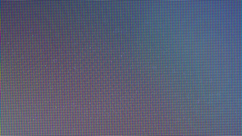 Extreme close-up of a display showing an RGB subpixel grid, revealing the red, green, and blue pixel structure.