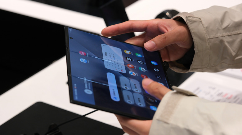 Someone using the Samsung Galaxy Z Trifold smartphone.