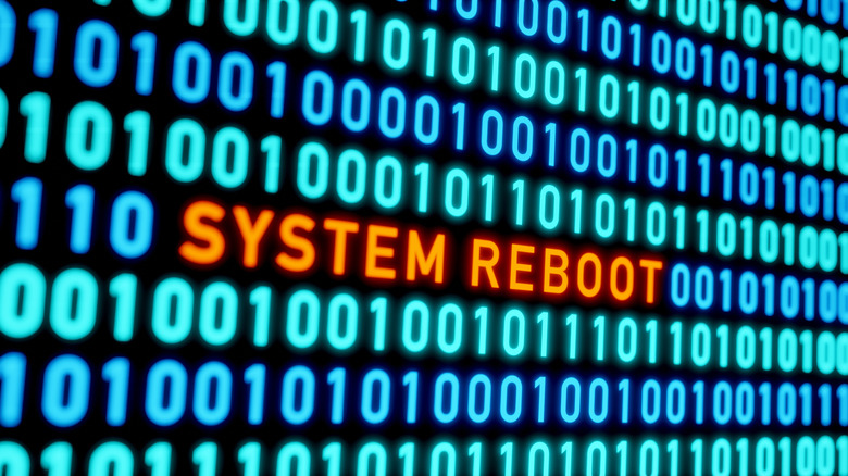 Digital display showing a "System Reboot" message surrounded by binary code.