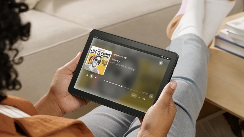 A person listening to Amazon Music on the Amazon Fire HD 8 (2024) tablet.