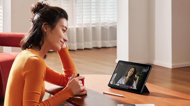 A woman using the Xiaomi Redmi Pad 2 tablet for a video call.