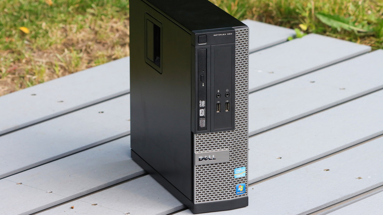 A Dell Optiplex PC on a table outdoors.