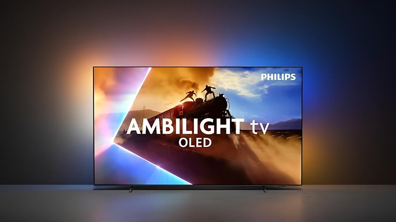 Philips OLED760 sat on a table with the Ambilight system working