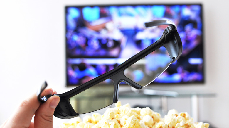 3D TV glasses and popcorn with TV in background