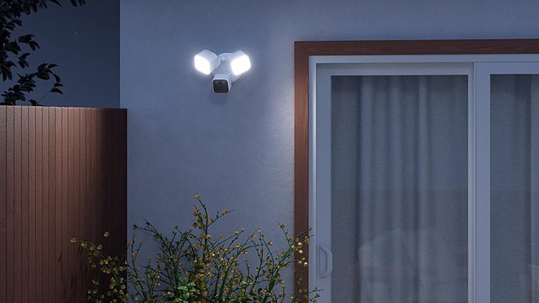 Floodlight camera mounted on an outdoor wall.