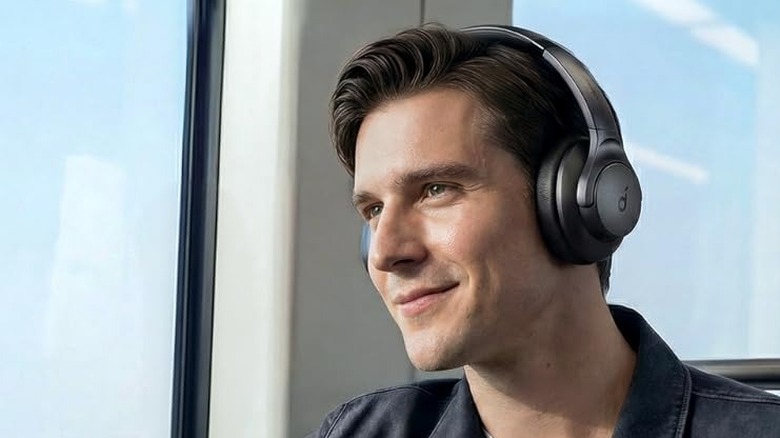 A man wearing the Anker Soundcore Q20i wireless headphones.