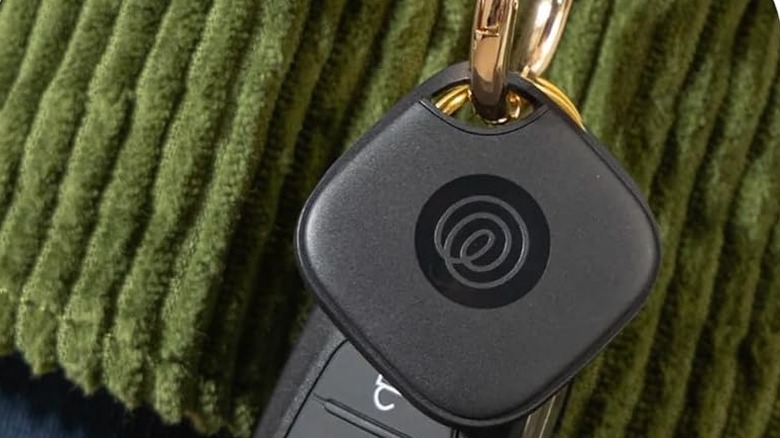 The Life360 Tile Mate Bluetooth tracker attached to car keys.