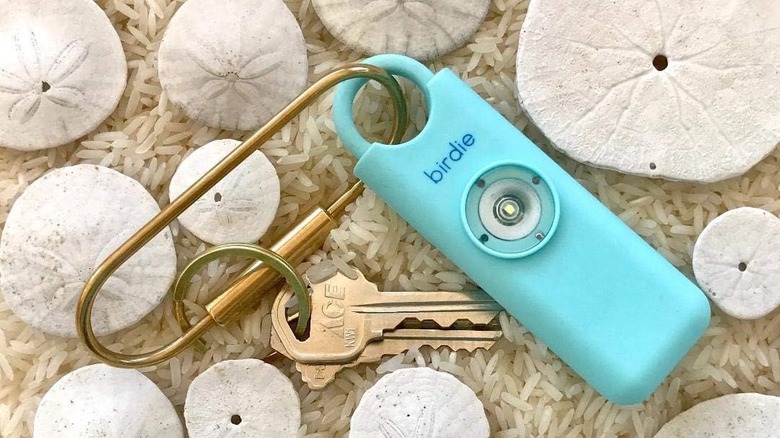 The She's Birdie personal safety alarm with keys attached.
