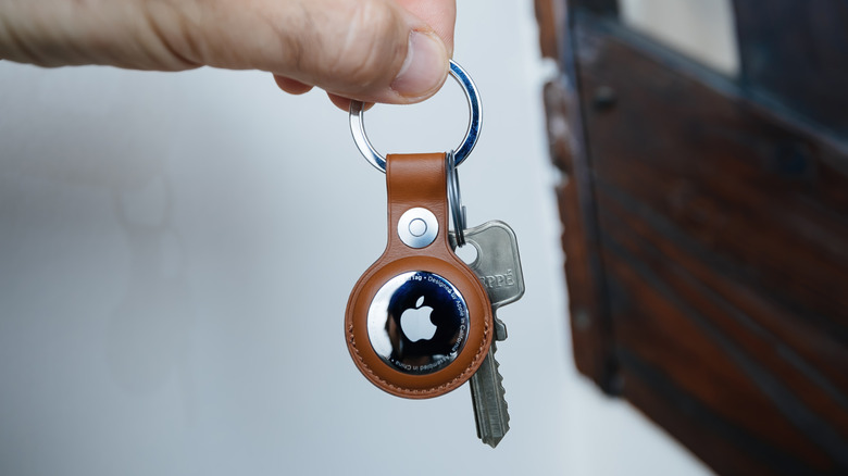 Apple's new AirTag 2 in a FineWoven fox orange key ring