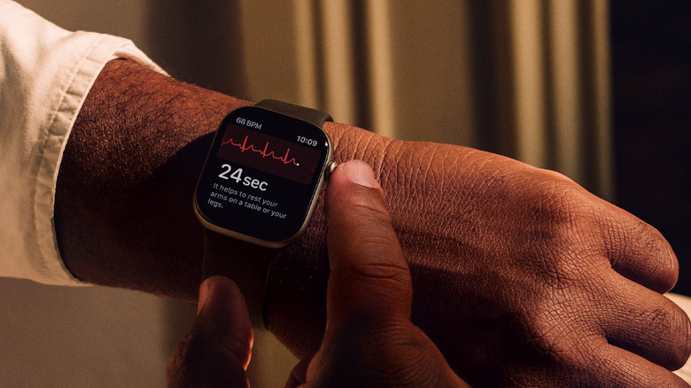 Apple Watch displaying a heart rate and health monitoring screen on a wrist