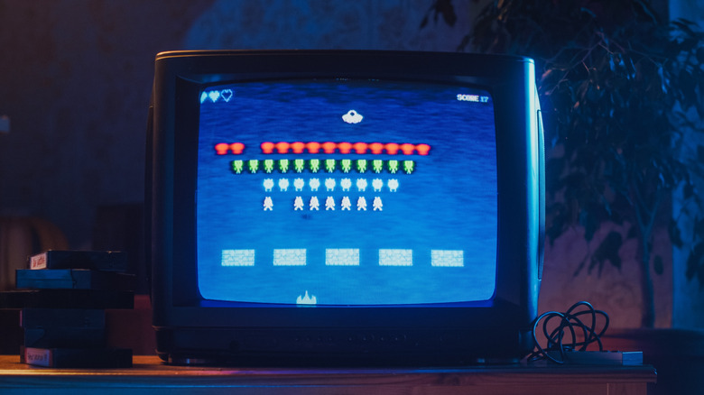 Image of the classic arcade game Space Invaders on an old CRT TV