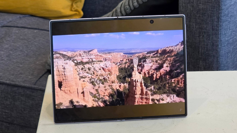 A Samsung Galaxy Z Fold 8 playing a YouTube video showing natural scenery.