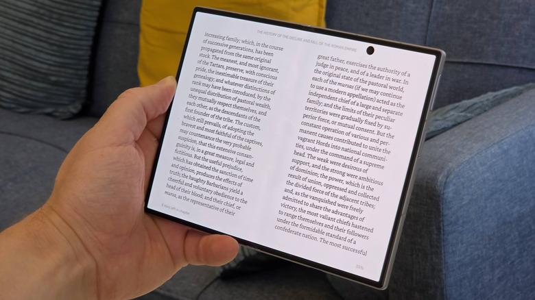 A Samsung Galaxy Z Fold 8 on the Kindle app showing an e-book.