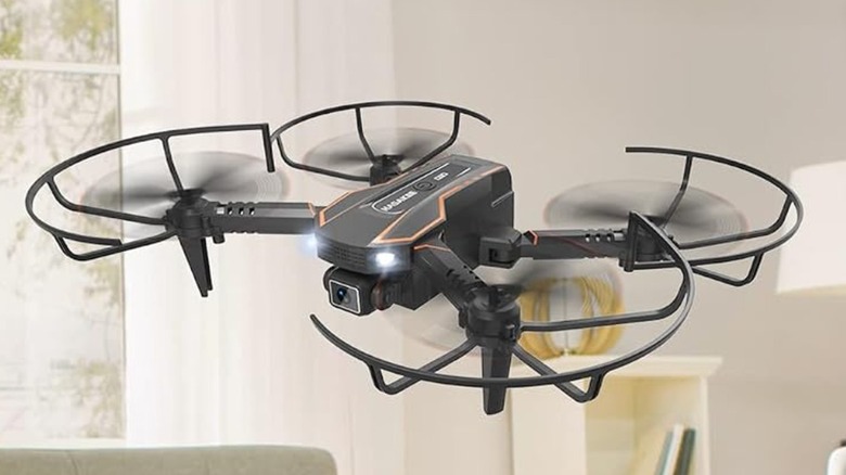 The Avialogic Q10 drone with flying through a white room